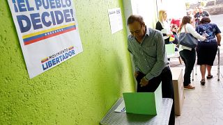 'Shooting at voting centre' as Venezuelan opposition holds unofficial referendum