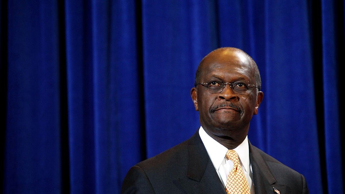 Image: Herman Cain speaks at a press conference in Scottsdale, Arizona, on 