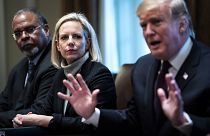 Image: President Donald Trump, flanked by Secretary of Homeland Security Ki