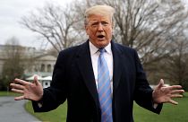 Image: President Donald Trump speaks to the media as he departs the White H
