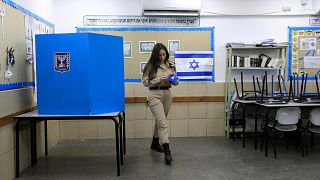 Image: An Israeli soldier votes during the general election in Ashkelon on 
