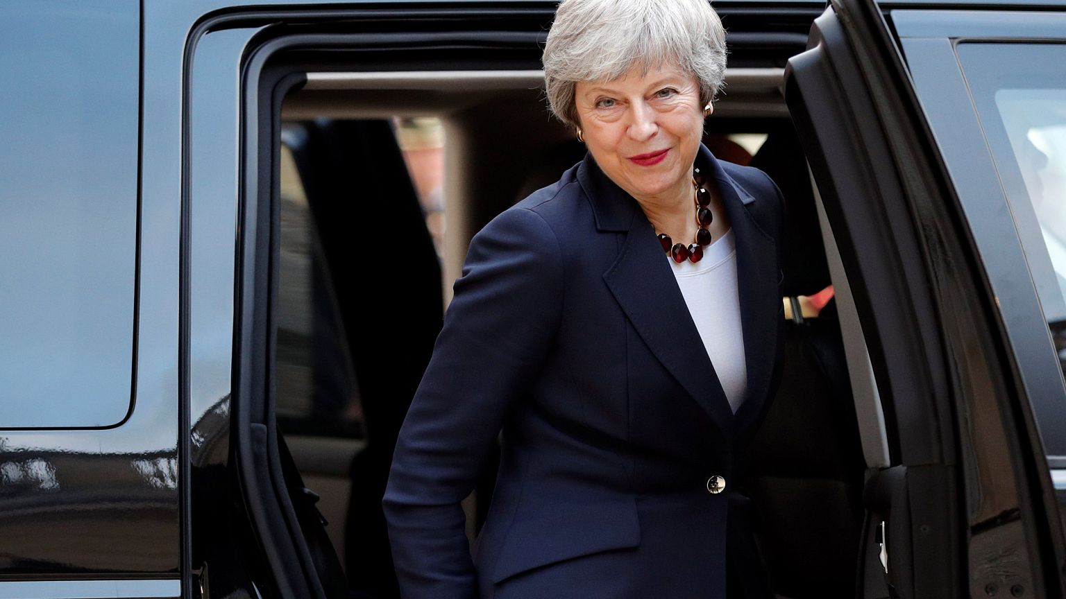 Image: British Prime Minister Theresa May leaves after a meeting with Frenc