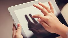 closeup of little boy using digital tablet