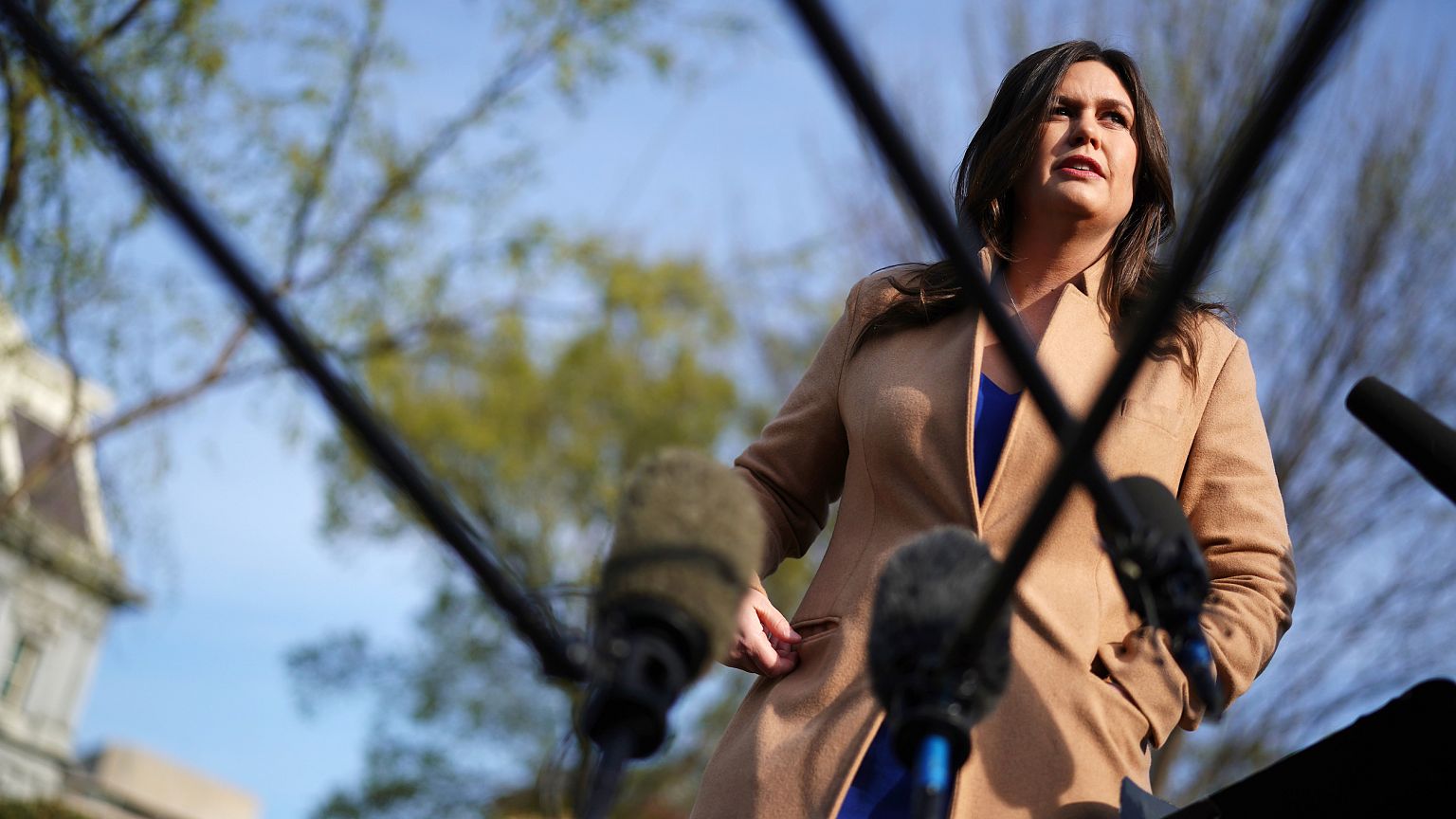 Image: White House Press Secretary Sarah Huckabee Sanders talks to reporter