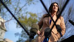 Image: White House Press Secretary Sarah Huckabee Sanders talks to reporter