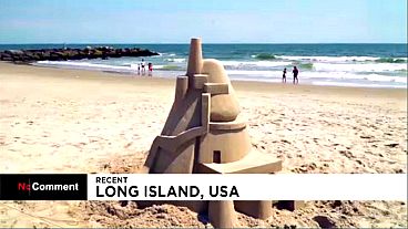 Artist travels an hour a day to build sand castles at a Long Island beach