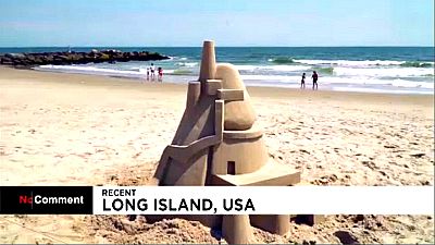Artist travels an hour a day to build sand castles at a Long Island beach