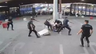Spanish policeman strikes armed attacker with bollard
