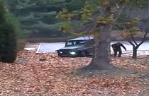 Image: A North Korean defector running out from a vehicle at the Joint Secu