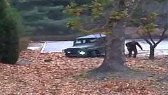 Image: A North Korean defector running out from a vehicle at the Joint Secu