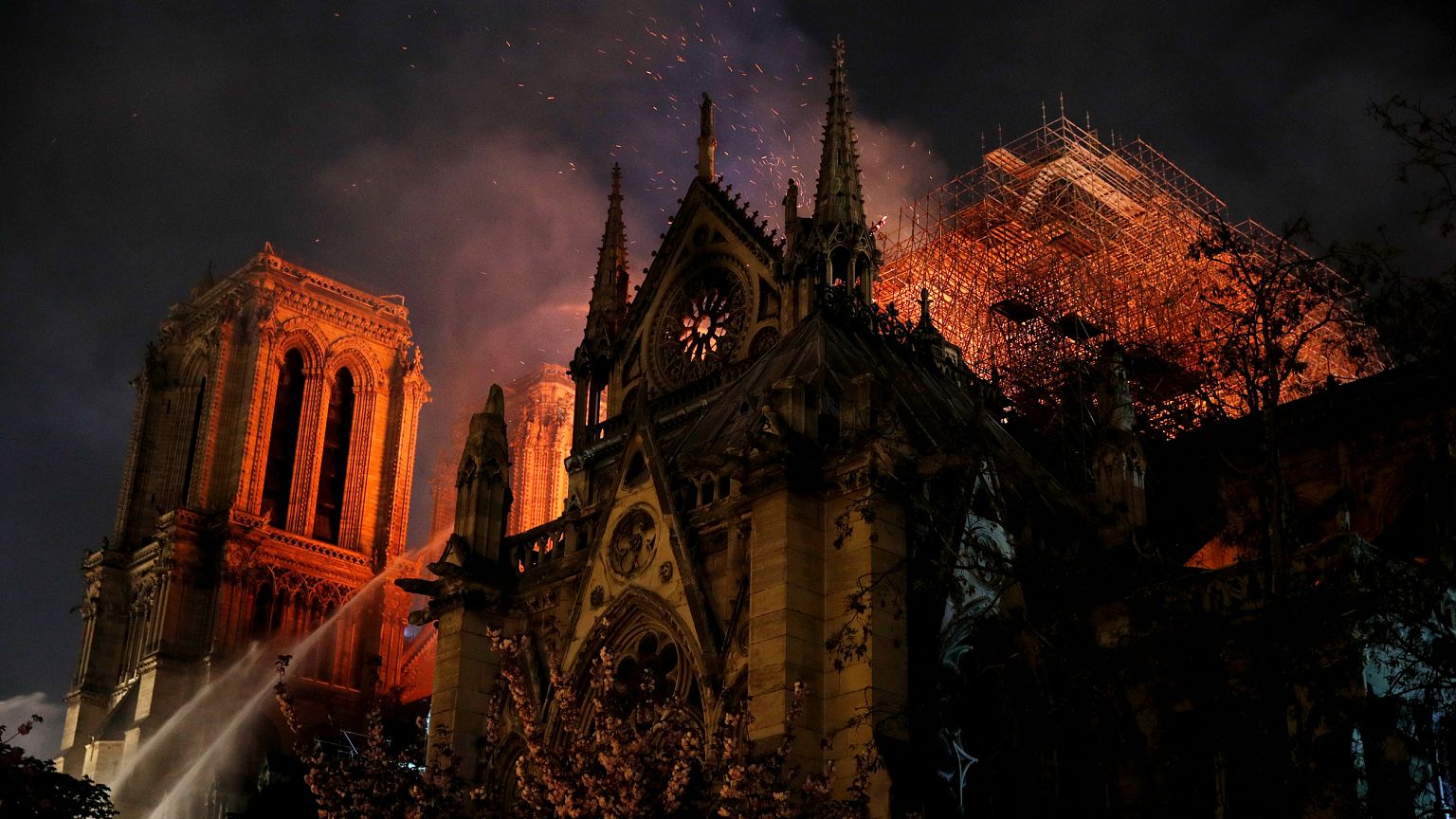 Image: Firefighters continue to extinguish flames at the Notre Dame Cathedr