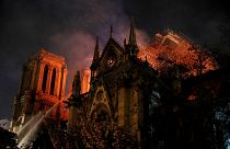 Image: Firefighters continue to extinguish flames at the Notre Dame Cathedr