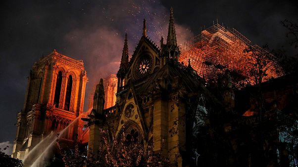 Image: Firefighters continue to extinguish flames at the Notre Dame Cathedr Image: Firefighters continue to extinguish flames at the Notre Dame Cathedr