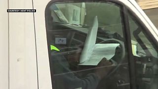 Watch: Lorry drivers caught doing paperwork and watching films at the wheel