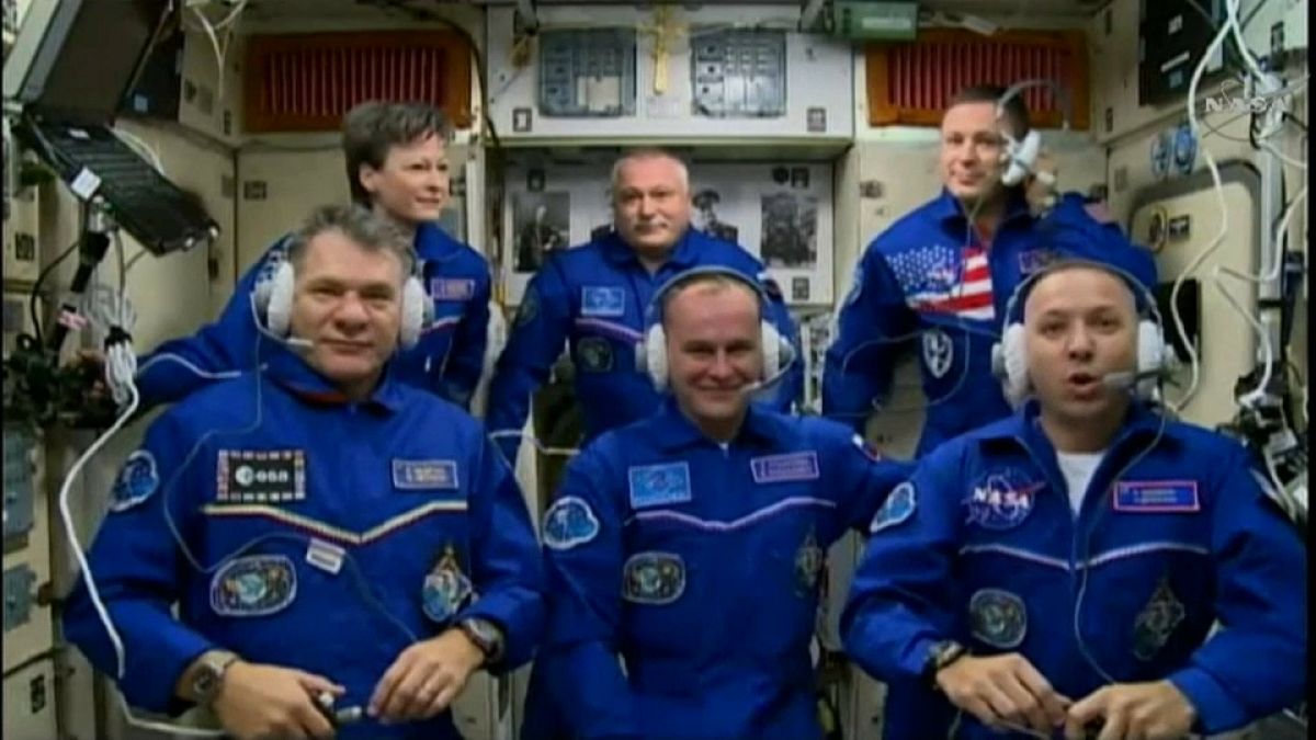 Astronauts safely join ISS