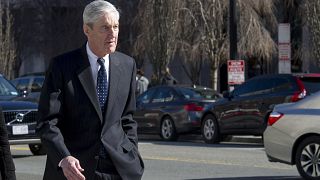 Image: Special Counsel Robert Mueller walks to his car after attending serv