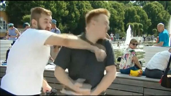 Watch: TV reporter punched during live broadcast Watch: TV reporter punched during live broadcast