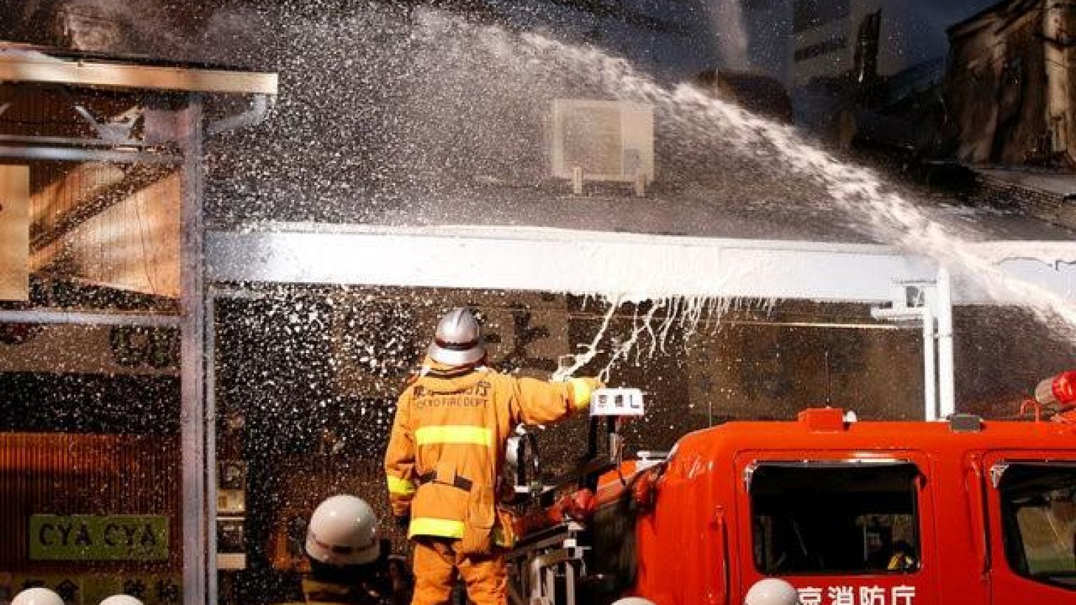 Tokyo firefighters tackle a blaze at world's largest fishmarket.