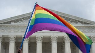 Image: A rainbow flag is flown outside the Supreme Court in Washington, DC