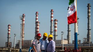 Image: Employees at a facility at the Persian Gulf Star Co. gas refinery in