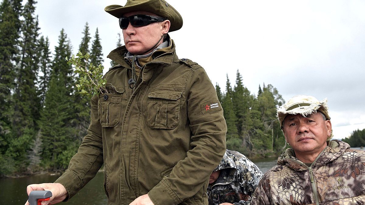 No one knows why Vladimir Putin is wearing a twig in his pocket