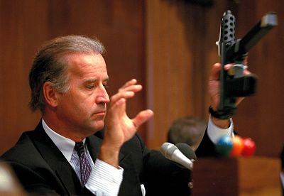 Sen. Joe Biden, chairman of the Senate Judiciary Committee, holds a TEC-9 semi-automatic weapon during a hearing on assault weapons at the Capitol on Aug. 3, 1993.