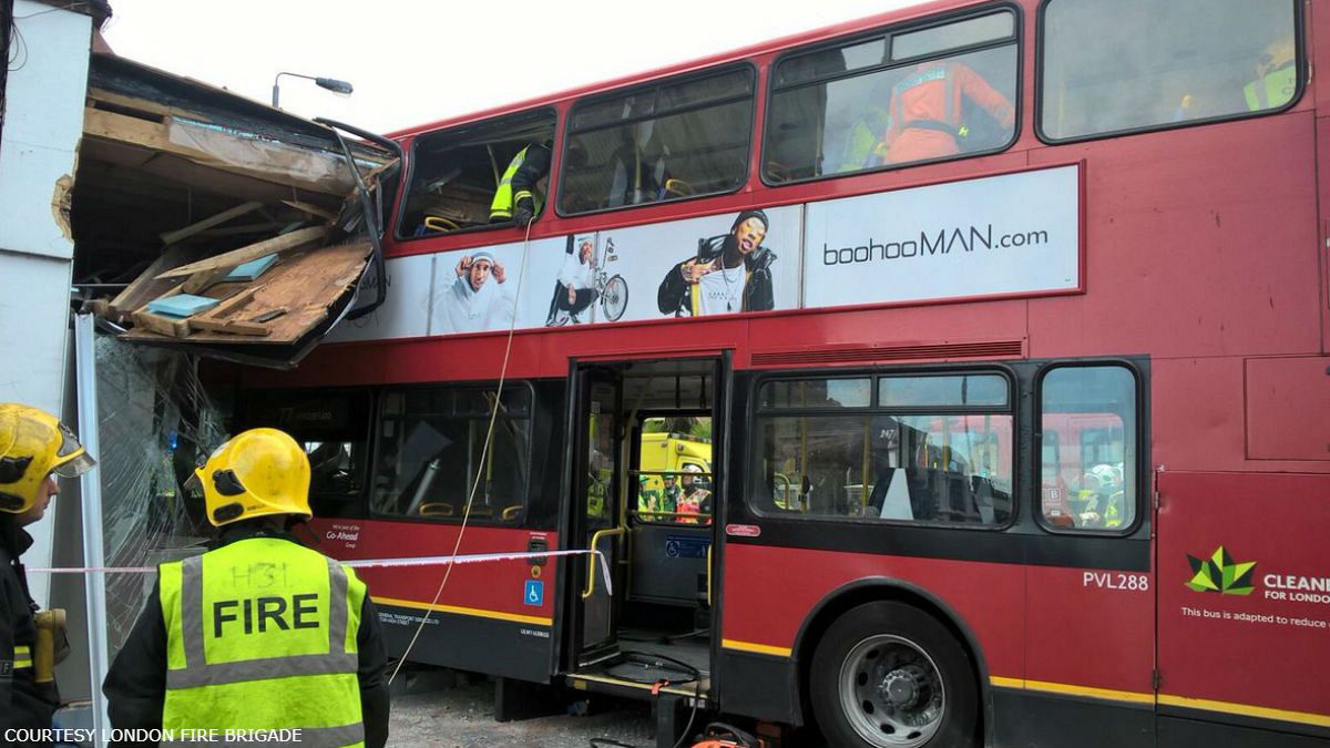 London bus crash: Two trapped as double decker smashes into shop