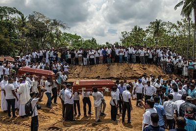 Coffins are carried during a mass funeral at St. Sebastian Church on April 23, 2019 in Negombo, Sri Lanka.