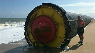 Giant pipes wash up on UK beach
