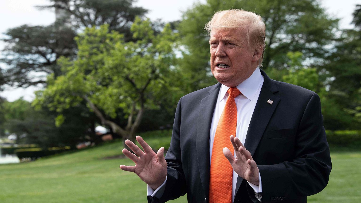 Image: President Donald Trump speaks to reporters at the White House