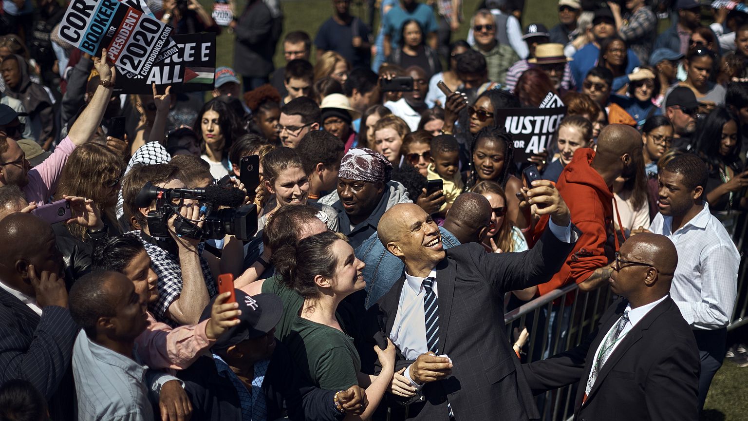Image: Sen. Cory Booker, D-NJ, takes a selfie with supporters during his ca