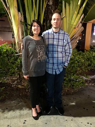 Todd Leininger stands with his mother, Barbara, after arriving in Miami on April 26, 2019.