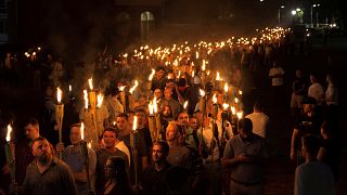 Image: White nationalists carry torches on the grounds of the University of