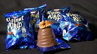 Nestle remove the walnuts from their whips.
