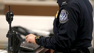A U.S. Customs and Immigration officer works a new border crossing during t