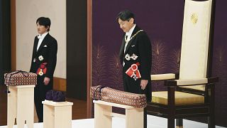 Image: Japan's Emperor Naruhito, flanked by Crown Prince Akishino, attends 