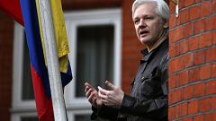 Image: Wikileaks founder Julian Assange speaks from a balcony at the Embass