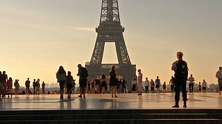 Tourists flock back to Paris a year after terror attacks