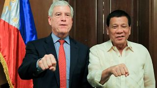 Australia defends spy chief's 'fist' salute with Philippines leader