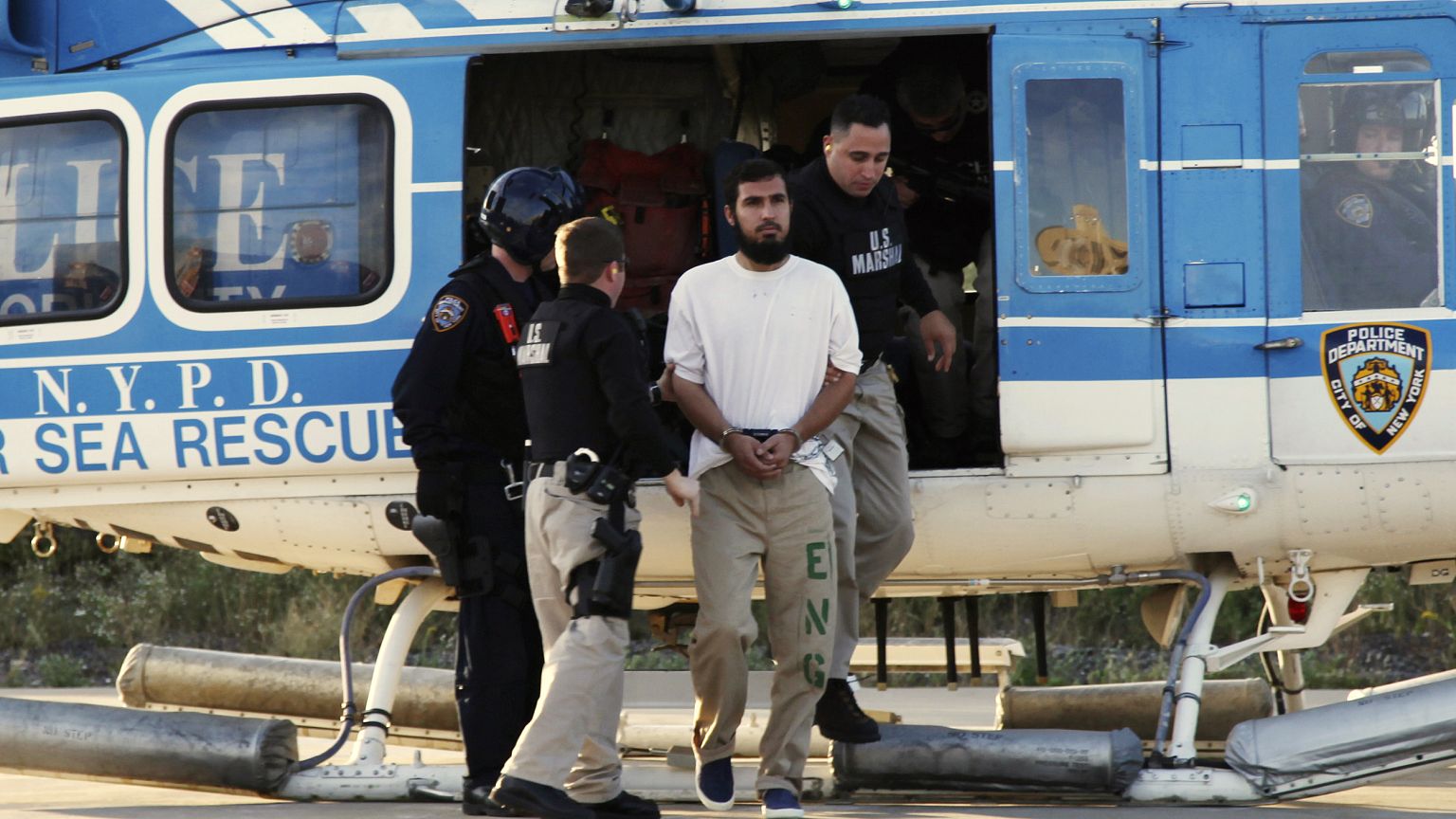 Image: Najibullah Zazi is escorted by US Marshals at a New York Police Depa