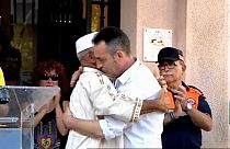 Father of three-year-old Barcelona attack victim hugs imam