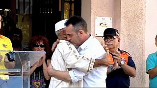 Father of three-year-old Barcelona attack victim hugs imam