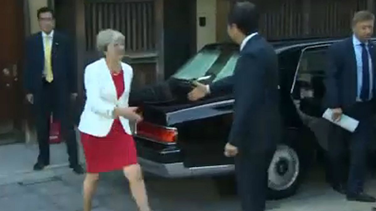 May's charm offensive in Japan