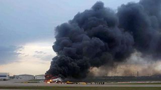 Image: A passenger plane is seen on fire after an emergency landing at the 