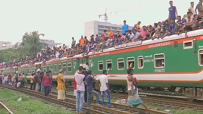 Bangladeshis swarm Dhaka trains to travel home for Eid al-Adha