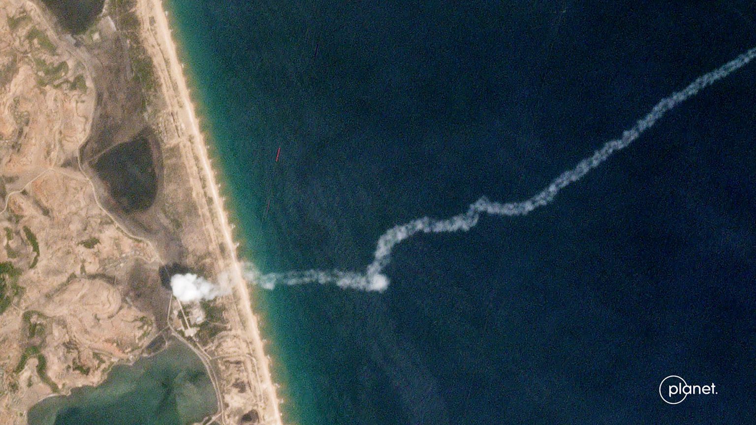 Image: The trail of a suspected North Korean missile is captured in a comme