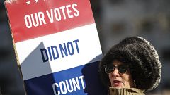 A protester at a rally at the Michigan State Capitol before the state elect