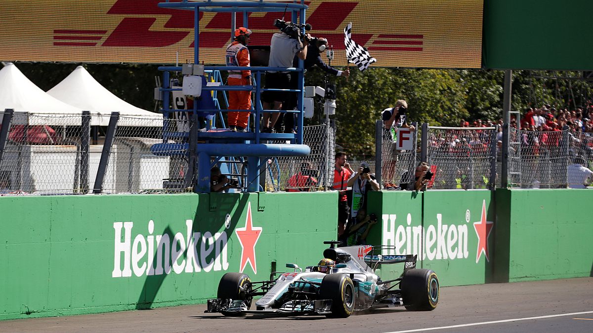 Britain's Lewis Hamilton wins Italian Grand Prix and takes lead in F1 championship