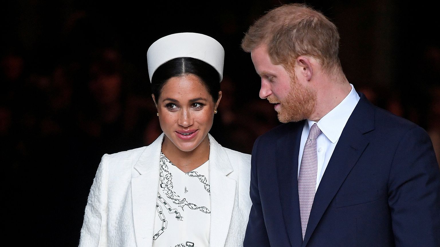 Britain's Prince Harry and Meghan, Duchess of Sussex, leave after the Commo