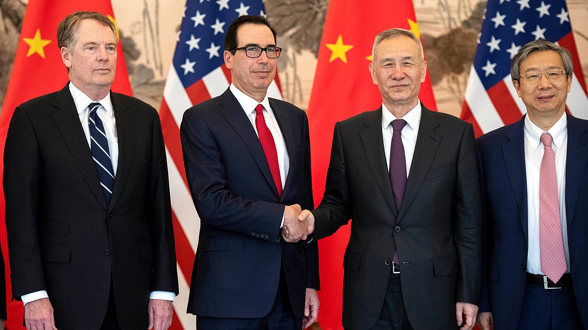 Image: China's Vice Premier Liu He shakes hands with U.S. Treasury Secretar